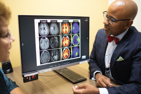 dr_johnson_scans Dr. Johnson showing scans to patient